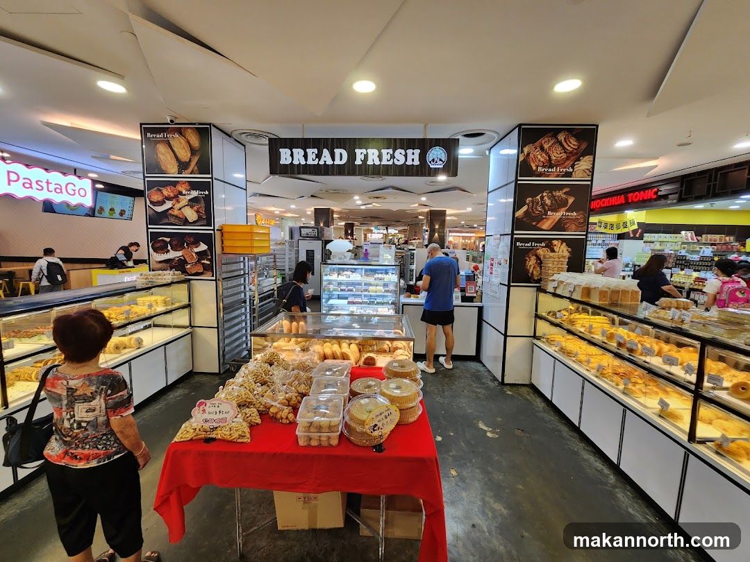 Bakery interior with displays of bread and pastries
