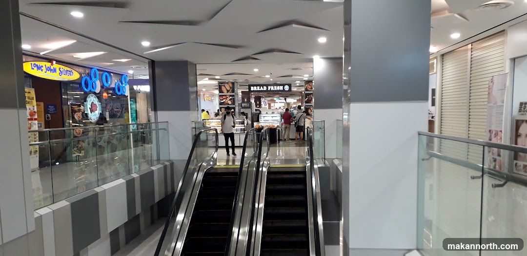 Mall Interior with Escalators and Shops