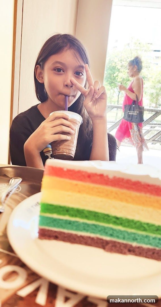 Girl with Rainbow Cake and Drink