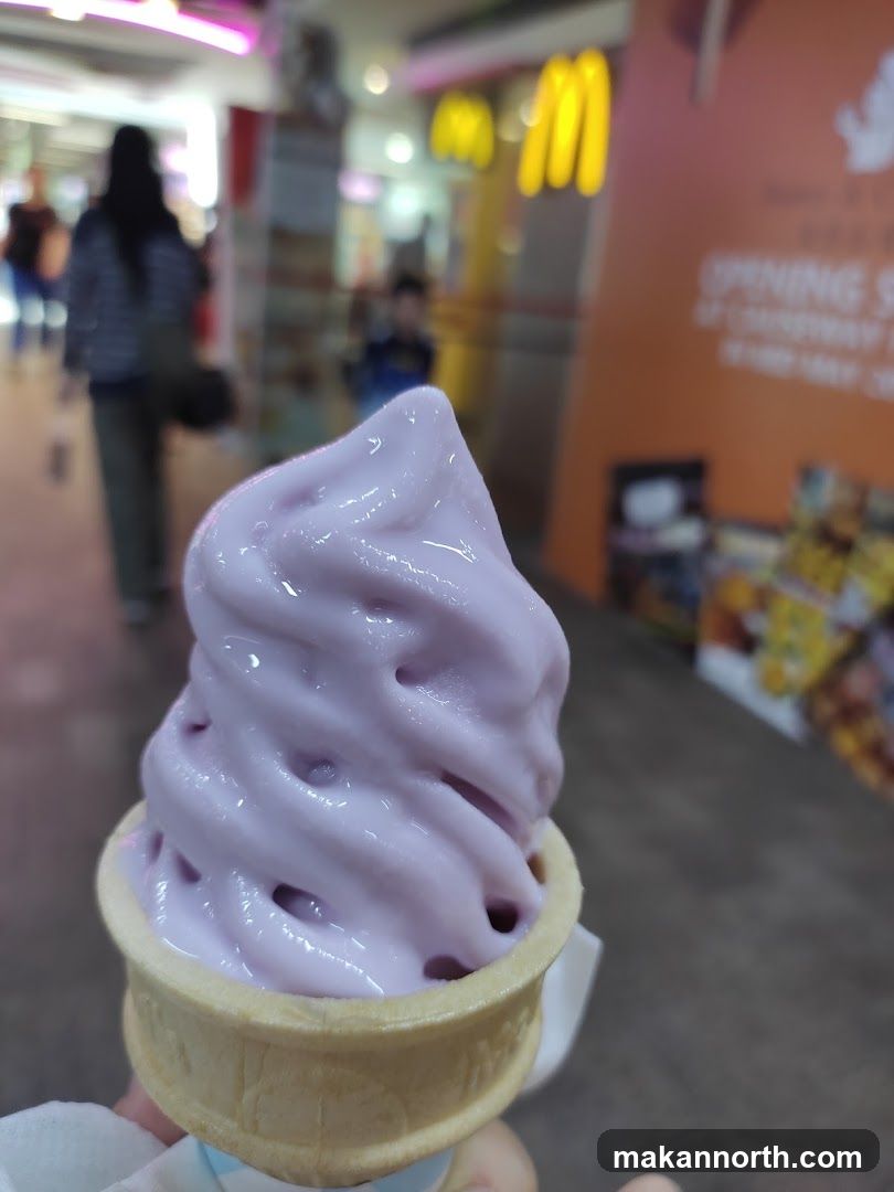 Purple soft serve ice cream cone
