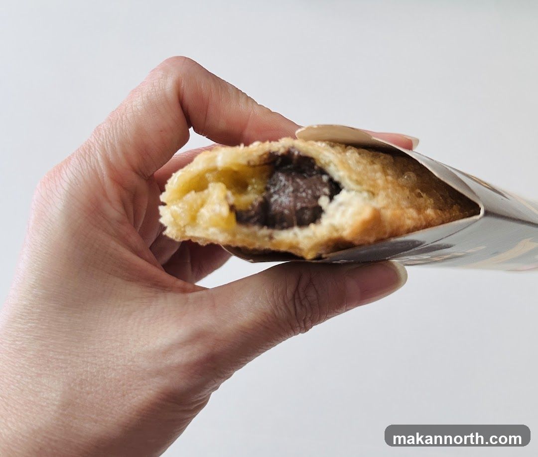Hand holding a pastry