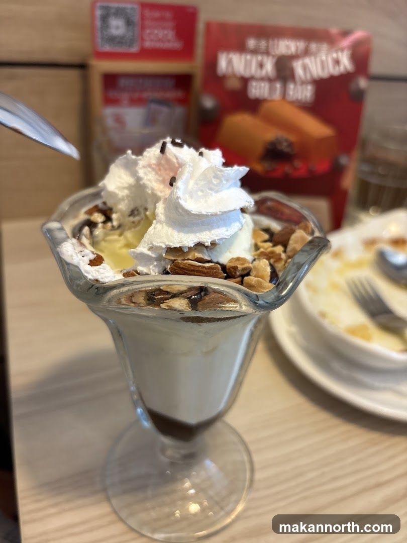 Ice Cream Sundae with Nuts and Whipped Cream