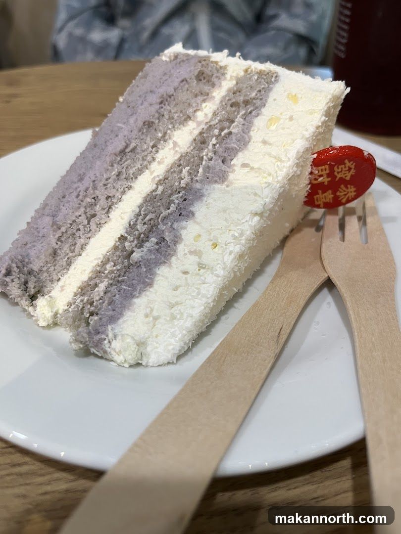 Slice of layered cake with a decorative pick