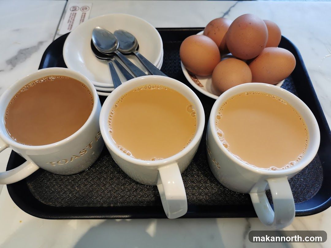 Three cups of milk tea and boiled eggs