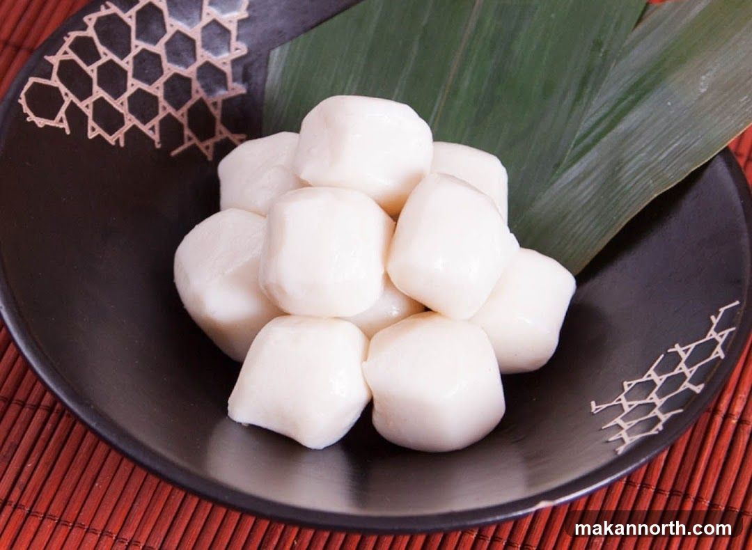 White Mochi Balls on a Black Plate