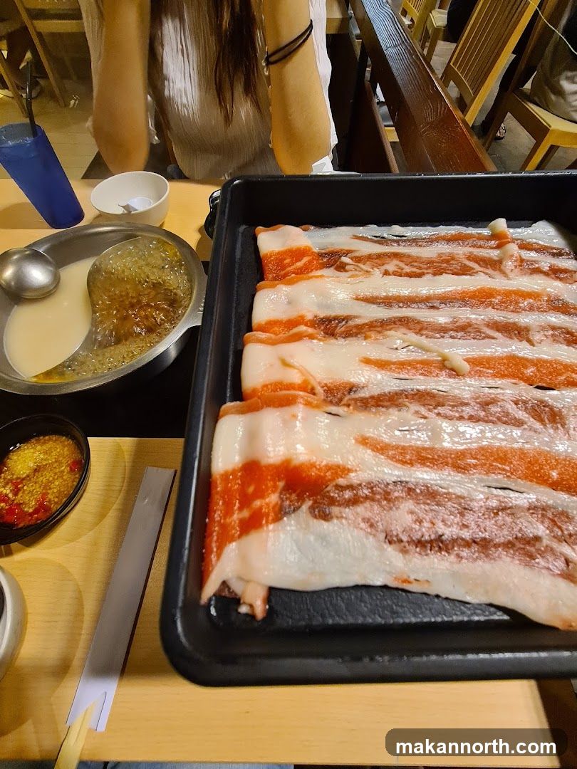 Thinly Sliced Raw Meat and Hot Pot