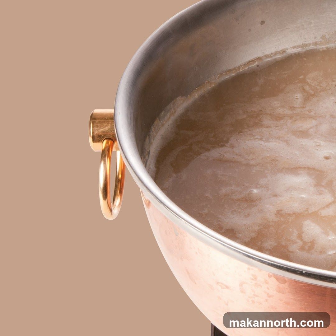 Close-up of a copper pot filled with a frothy liquid