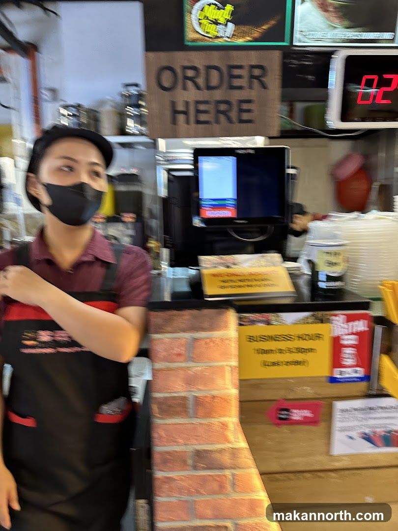 Counter with staff and ordering sign