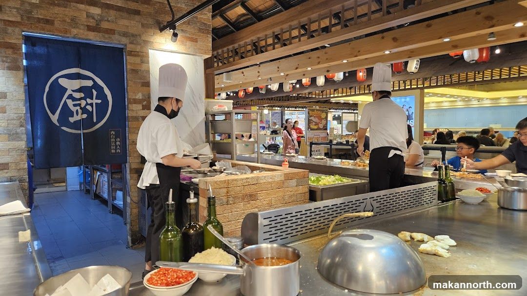 Teppanyaki chefs preparing food