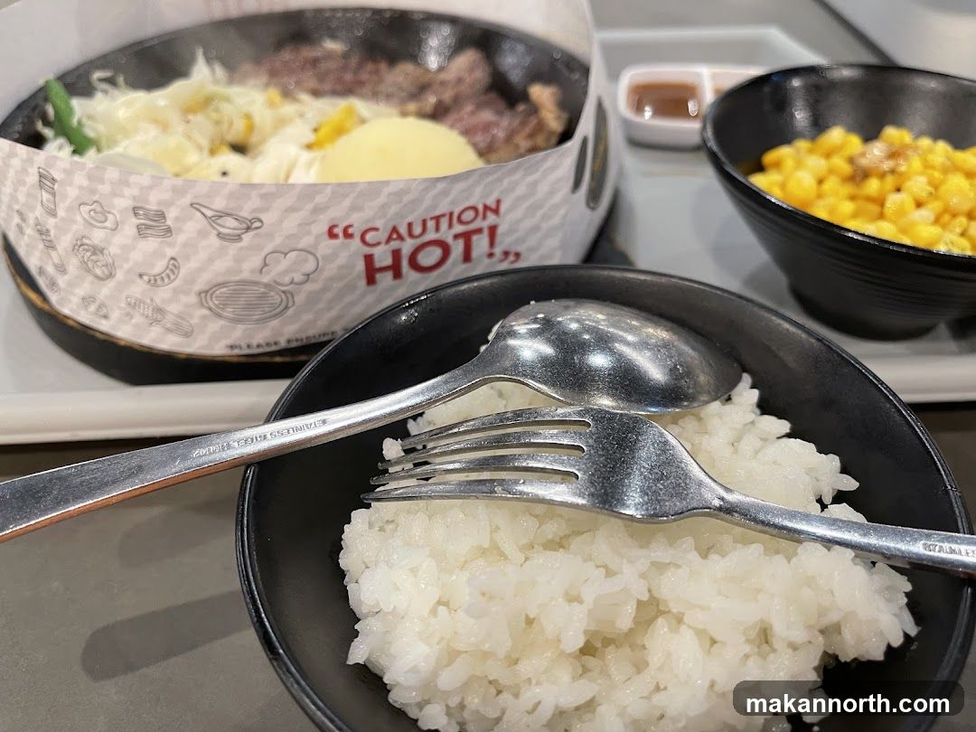 Sizzling Meal with Rice and Corn