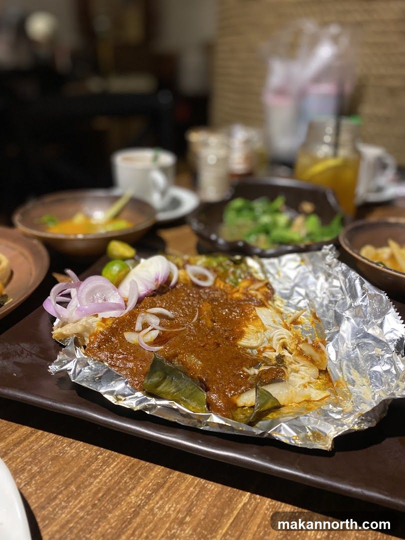 Fish dish with sauce and onions