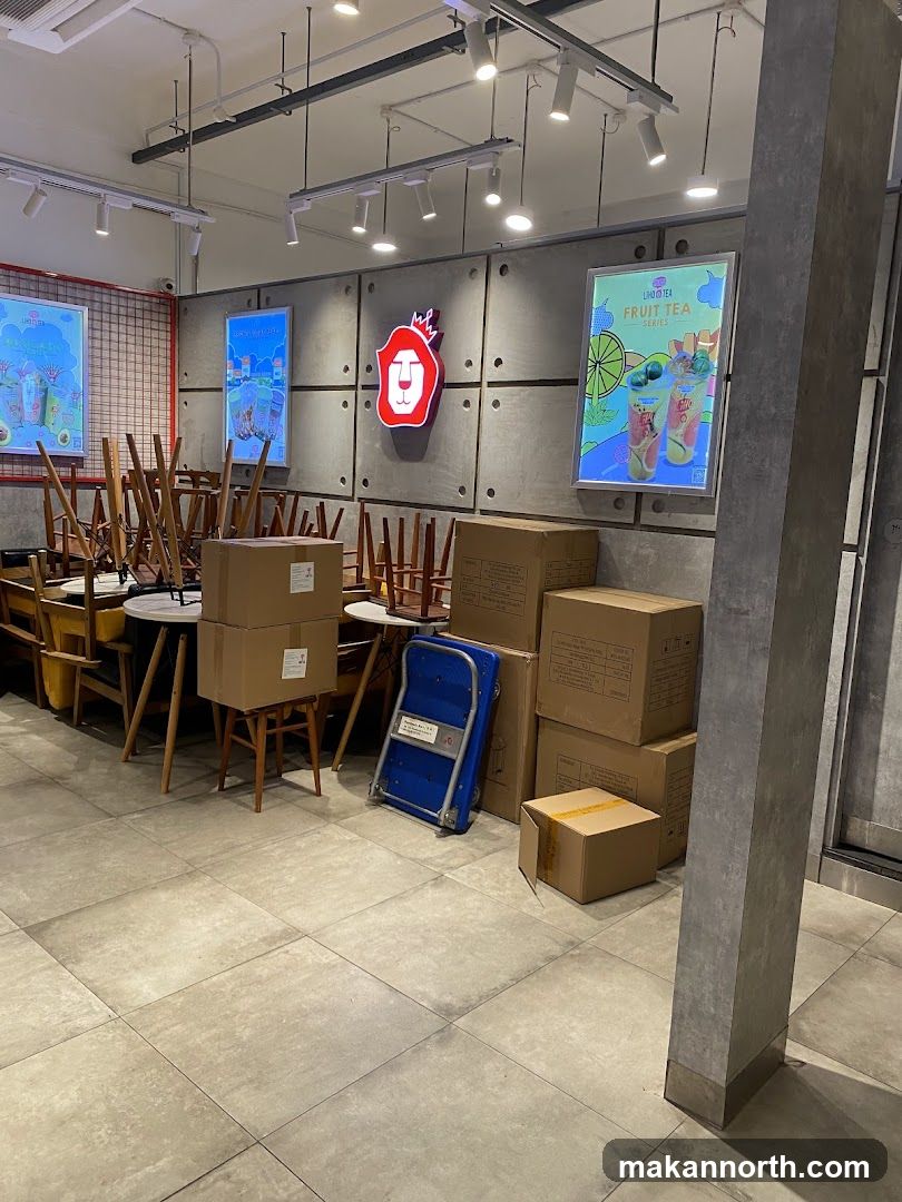 Empty cafe with stacked chairs and boxes