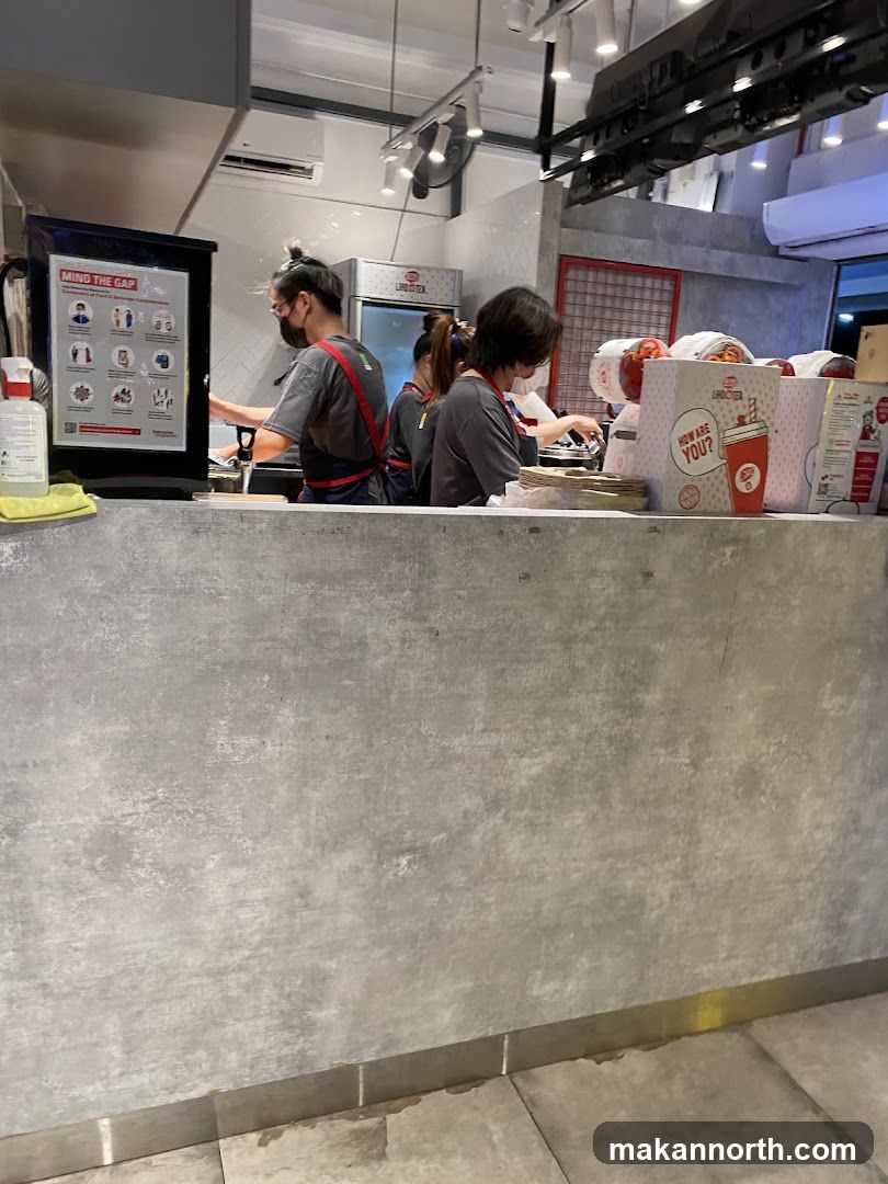 Staff preparing drinks behind a counter