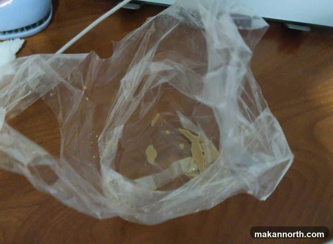 Empty plastic bag with residue