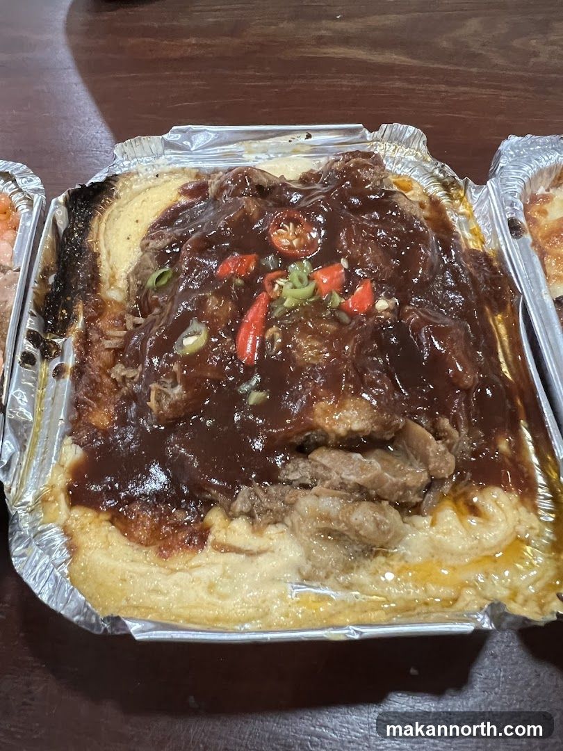 Meat dish with sauce and chili peppers