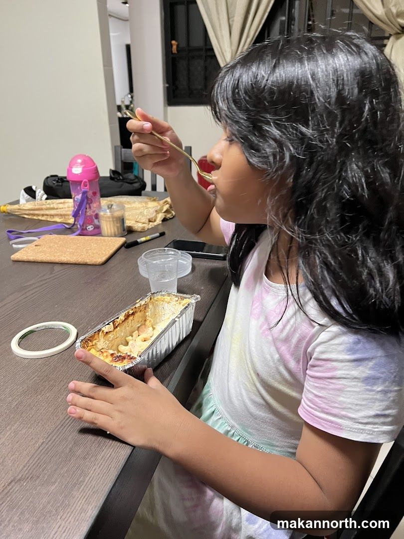Girl eating mac and cheese