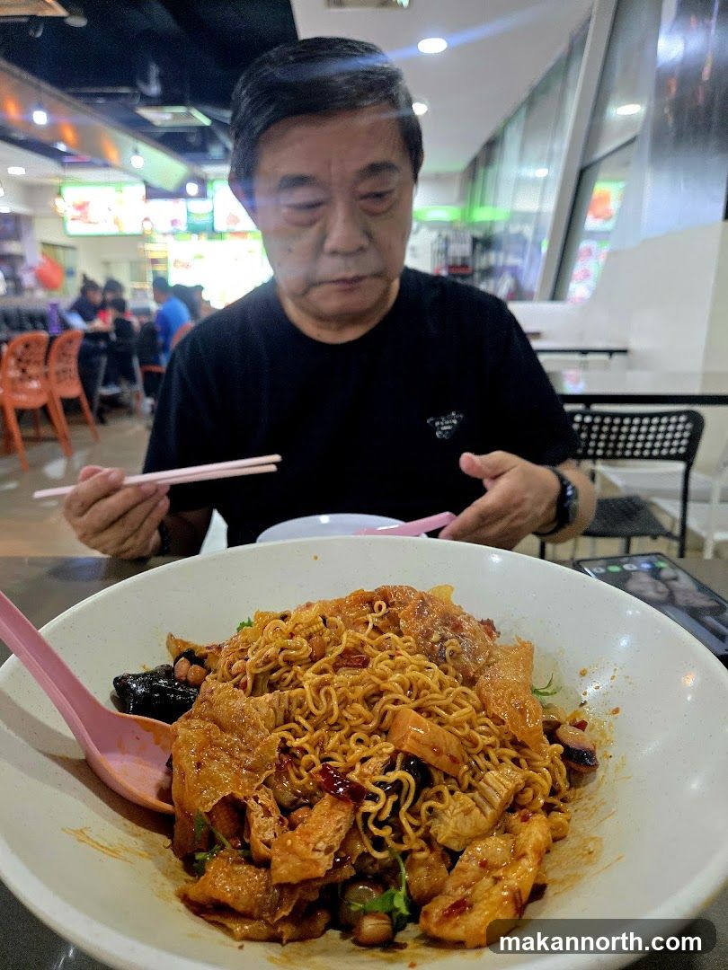 Man Eating Noodles