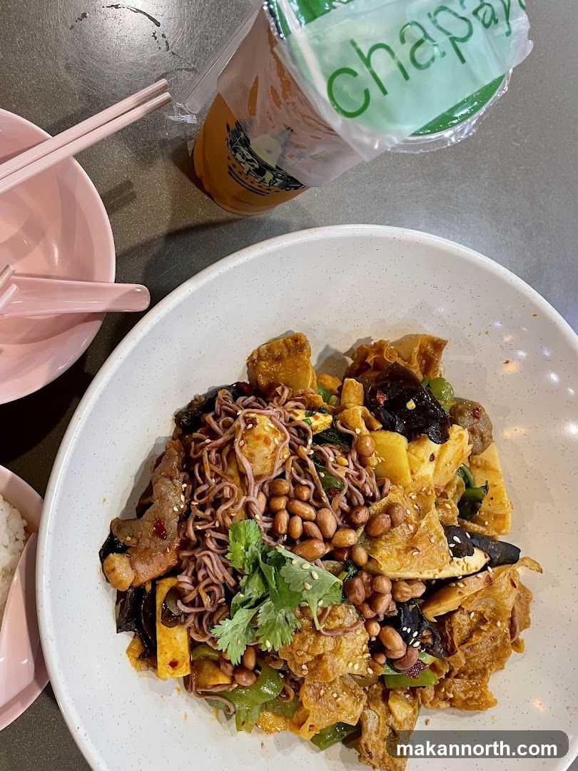 Spicy Noodle Dish with Peanuts and Drink