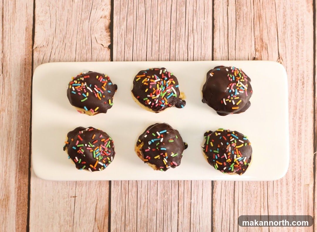 Chocolate-covered pastries with sprinkles