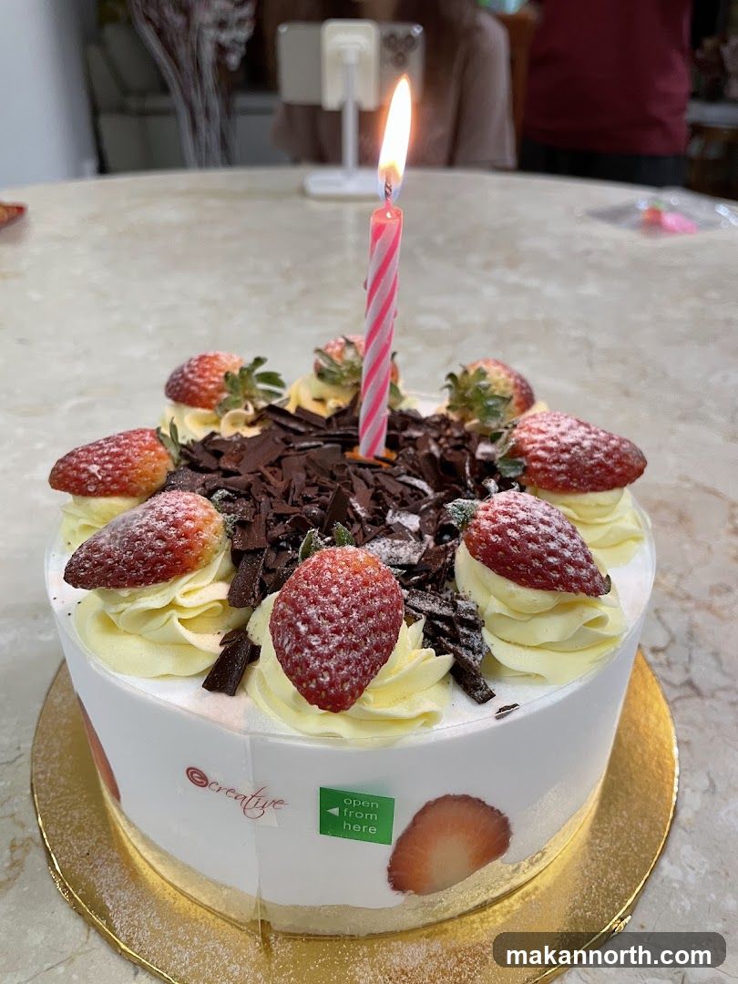 Birthday Cake with Strawberries and Chocolate Shavings