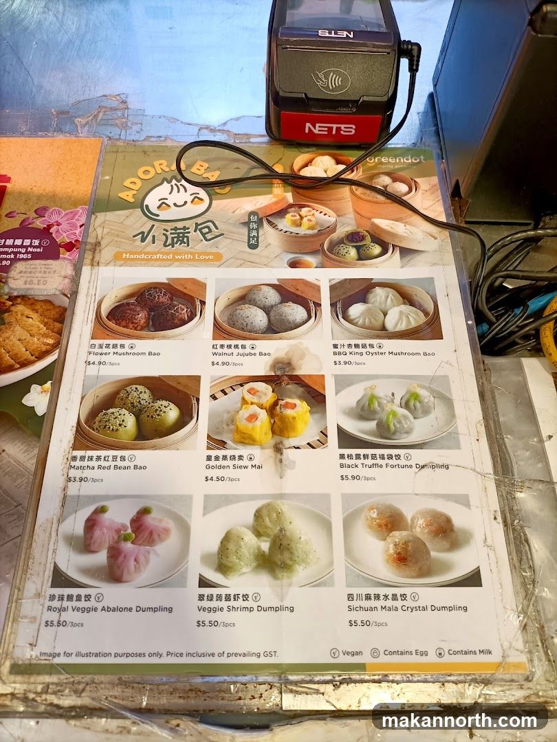 A menu featuring various steamed buns and dumplings with images and prices.