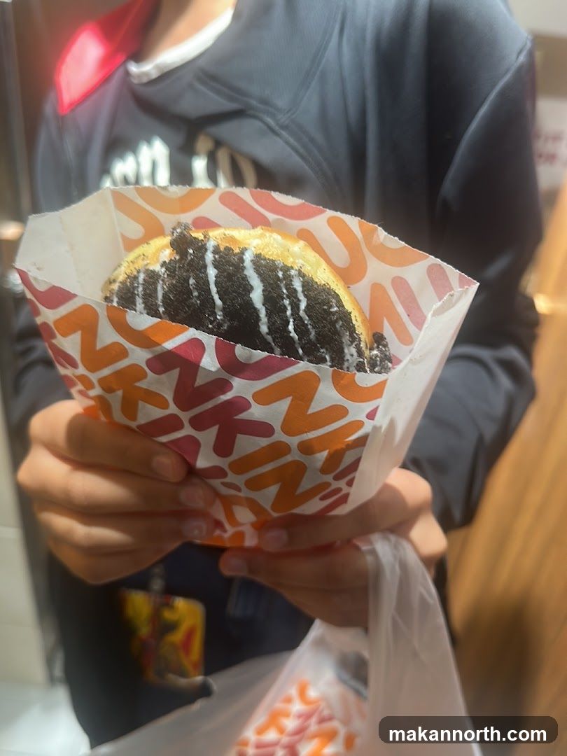 Person holding a donut