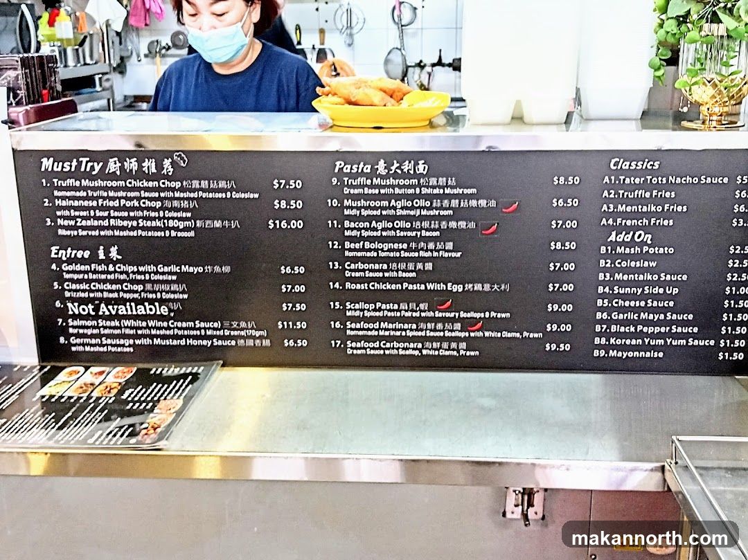 A menu board with three columns: Must Try Chef Recommended, Pasta, and Classics. The Must Try section includes truffle mushroom chicken chop, Hainanese fried pork chop, and New Zealand ribeye steak. The Pasta section features truffle mushroom, mushroom aglio olio, bacon aglio olio, beef bolognese, carbonara, roast chicken pasta, scallop pasta, seafood marinara, and seafood carbonara. The Classics section lists tater tots, truffle fries, mentalko fries, and french fries. An Add On section includes mash potato, coleslaw, mentaiko sauce, sunny side up, cheese sauce, garlic maya sauce, black pepper sauce, Korean yum yum sauce, and mayonnaise.