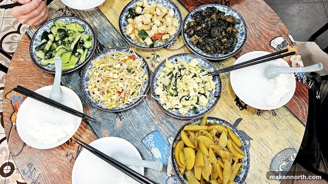 Table with various dishes and rice