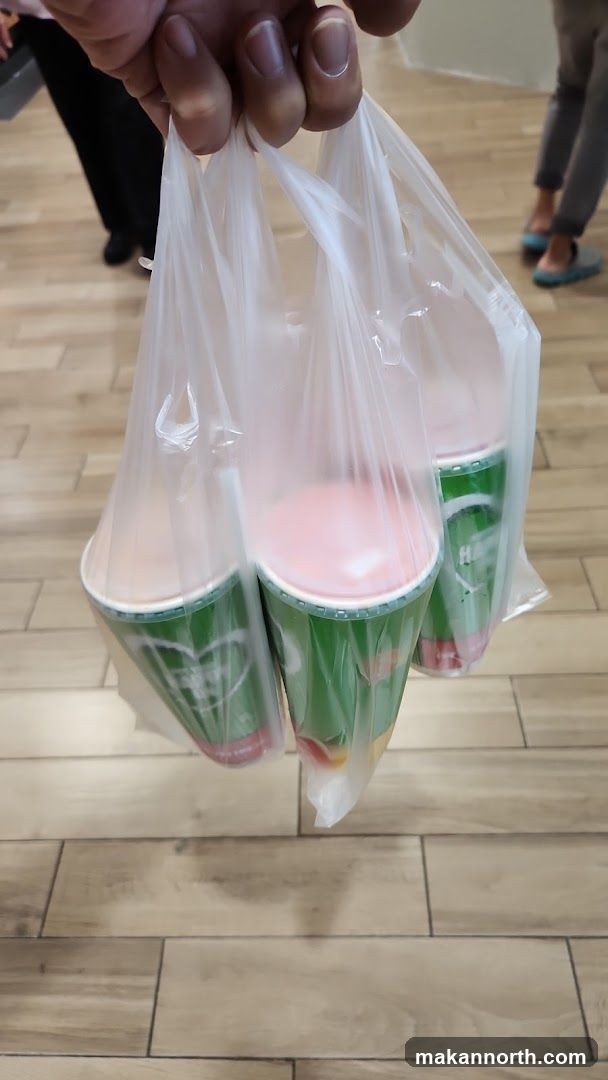 Three drinks in plastic bags