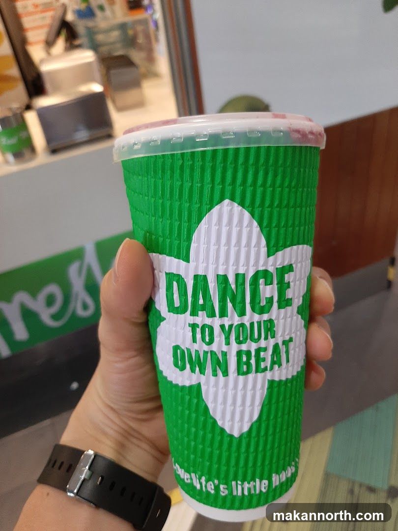 Green cup with text