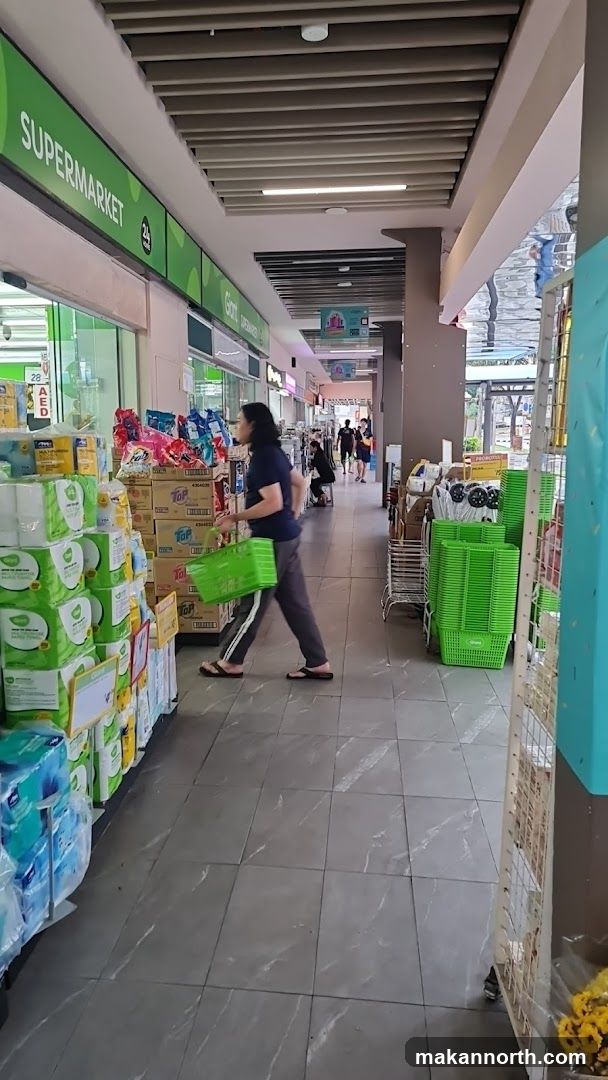 Supermarket aisle with person shopping