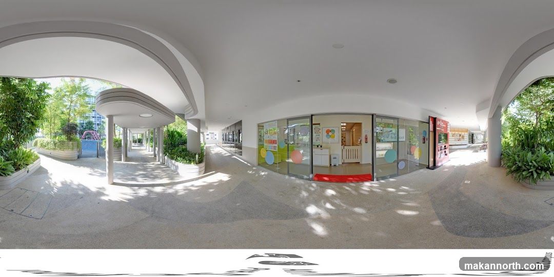 Outdoor walkway with playground and school entrance