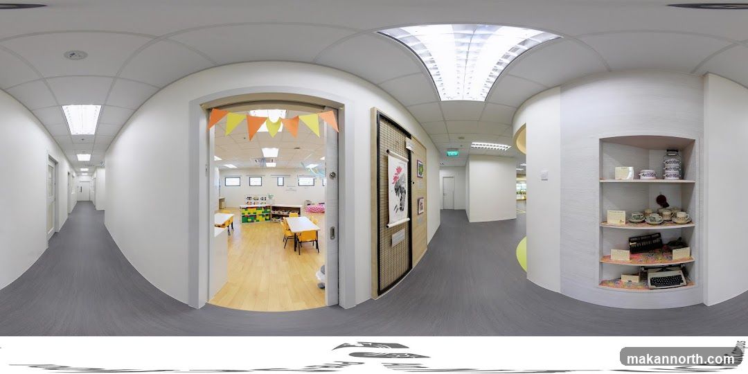 Interior hallway with classroom and display shelf