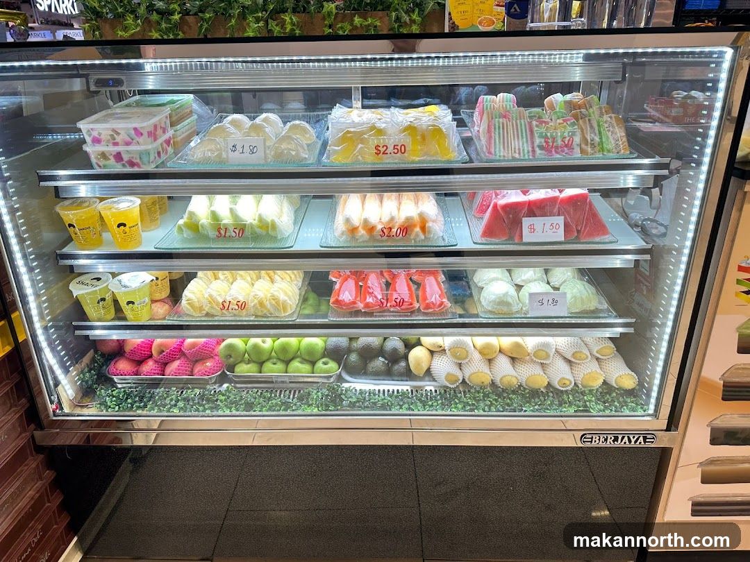 Refrigerated Display Case with Fruits and Desserts