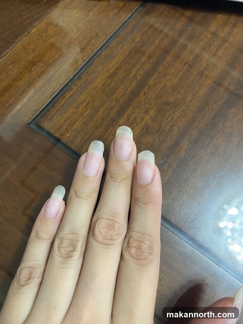 Fingernails on Wooden Surface