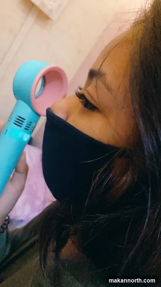 Woman with Eyelash Extensions and Fan