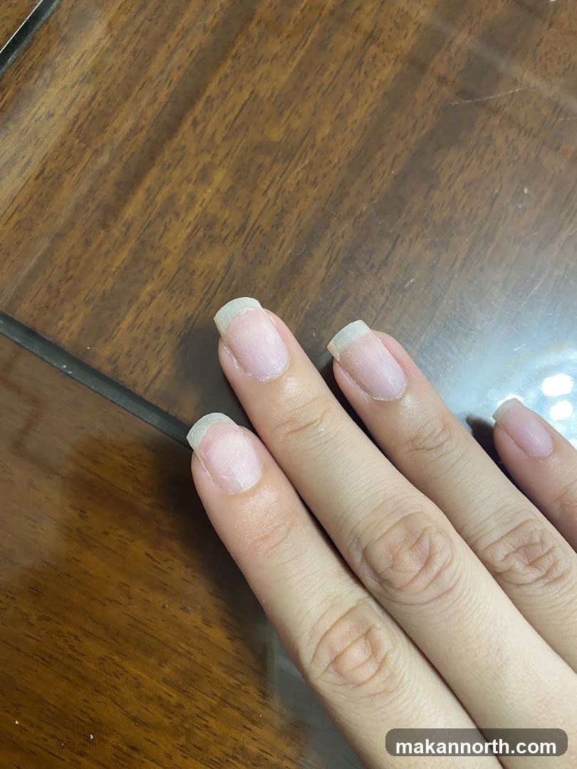 Fingernails on Wooden Surface