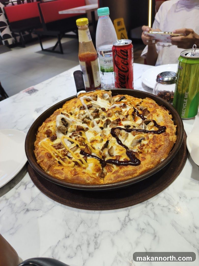 Pizza with Condiments and Drinks