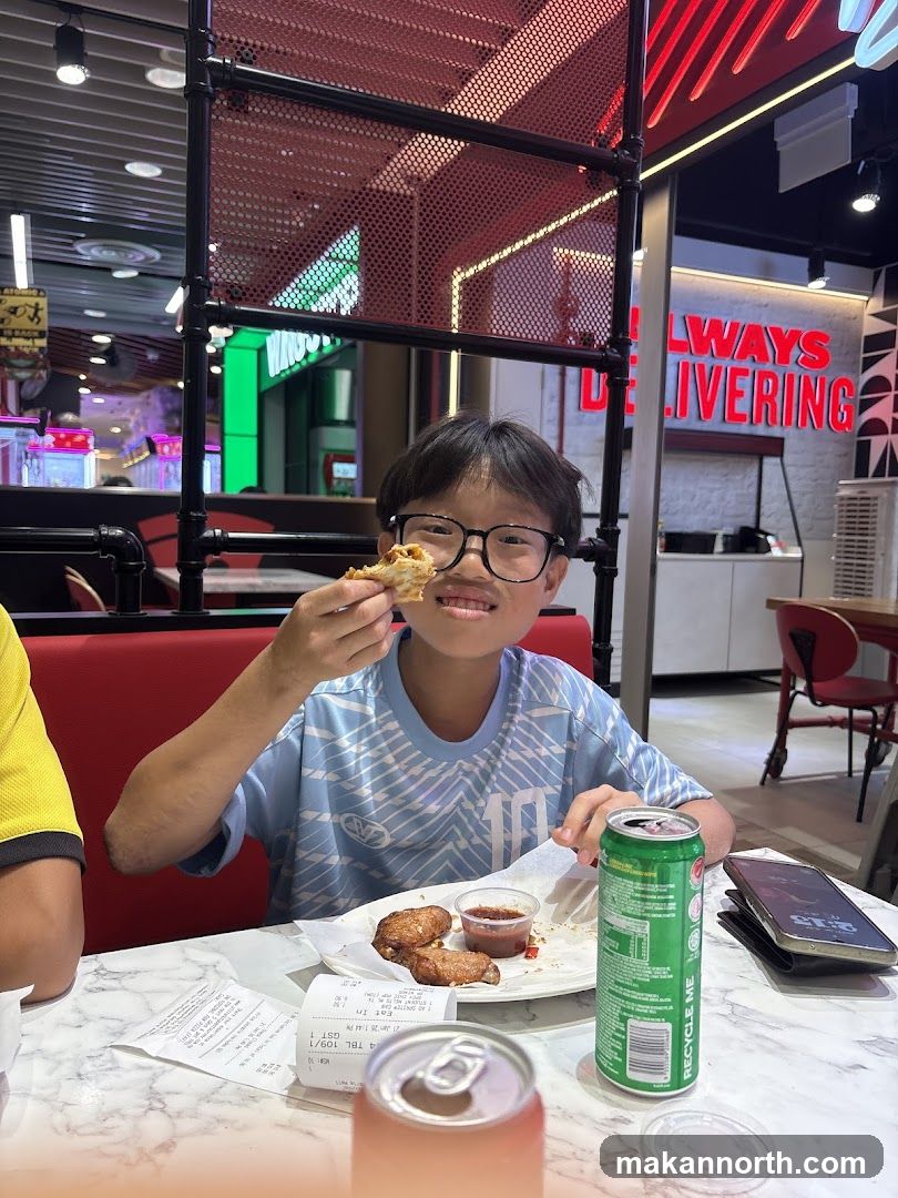 Boy eating chicken wings