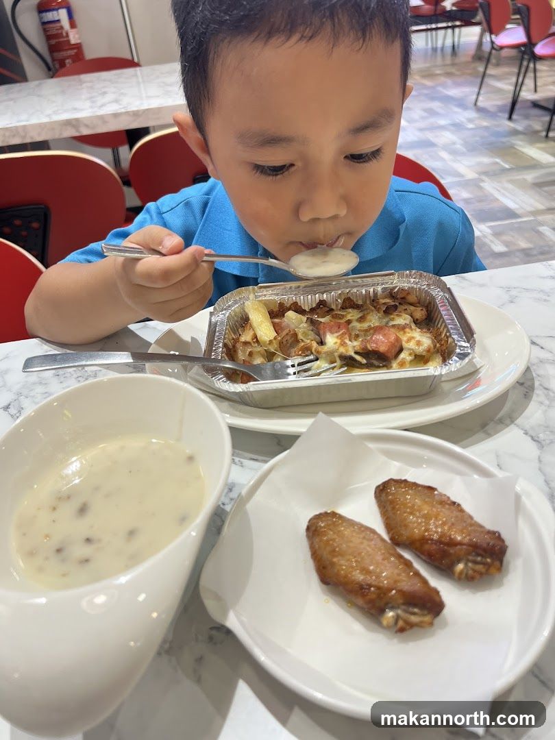 Boy eating pasta