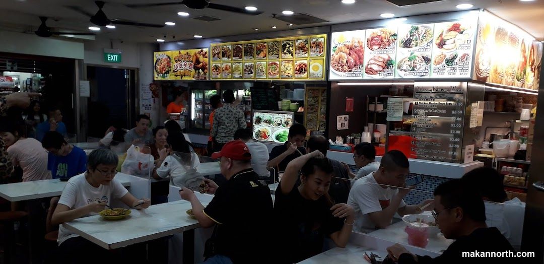 Busy Food Stall with Diners