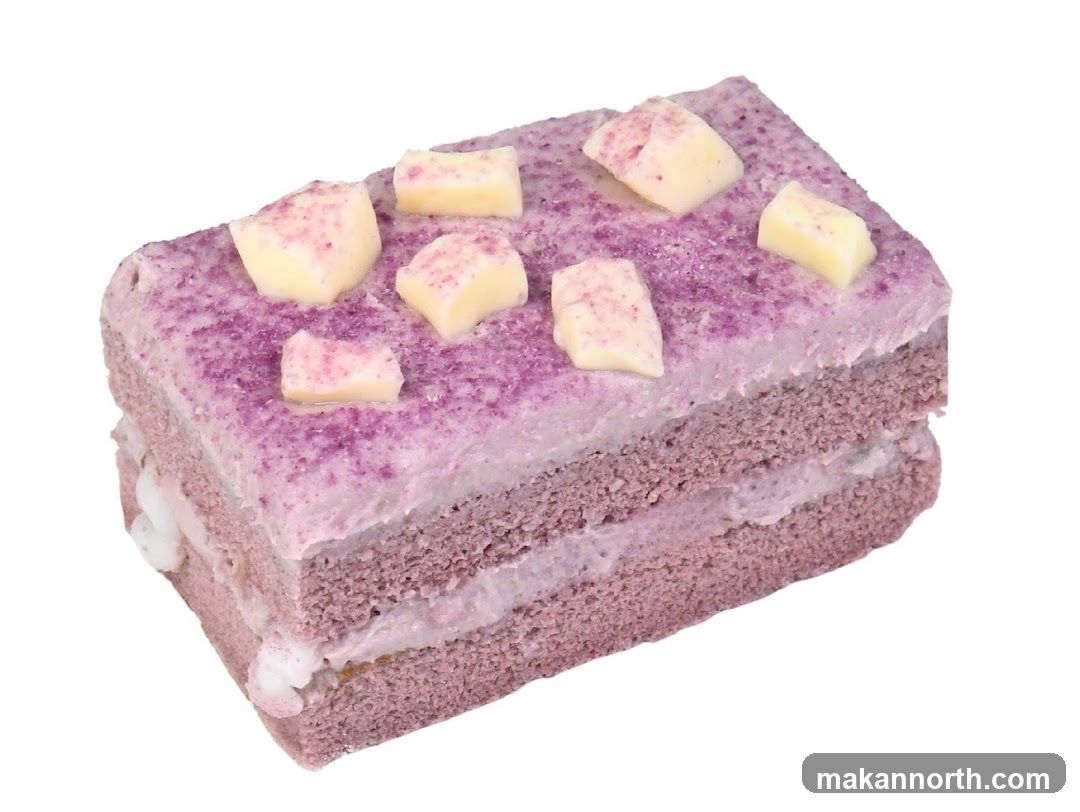 Purple layered cake with white chocolate chunks