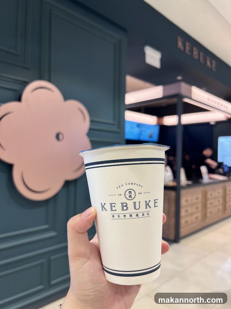 Hand Holding a Kebuke Tea Cup