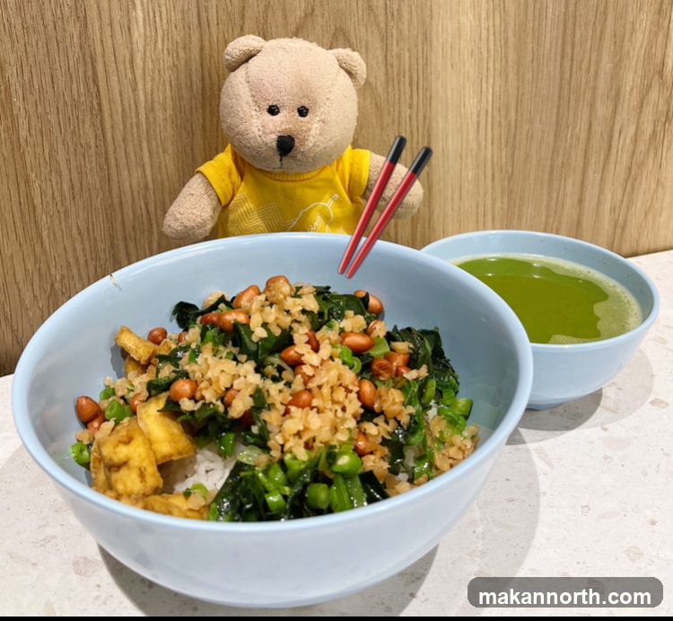 Rice bowl with vegetables and a drink