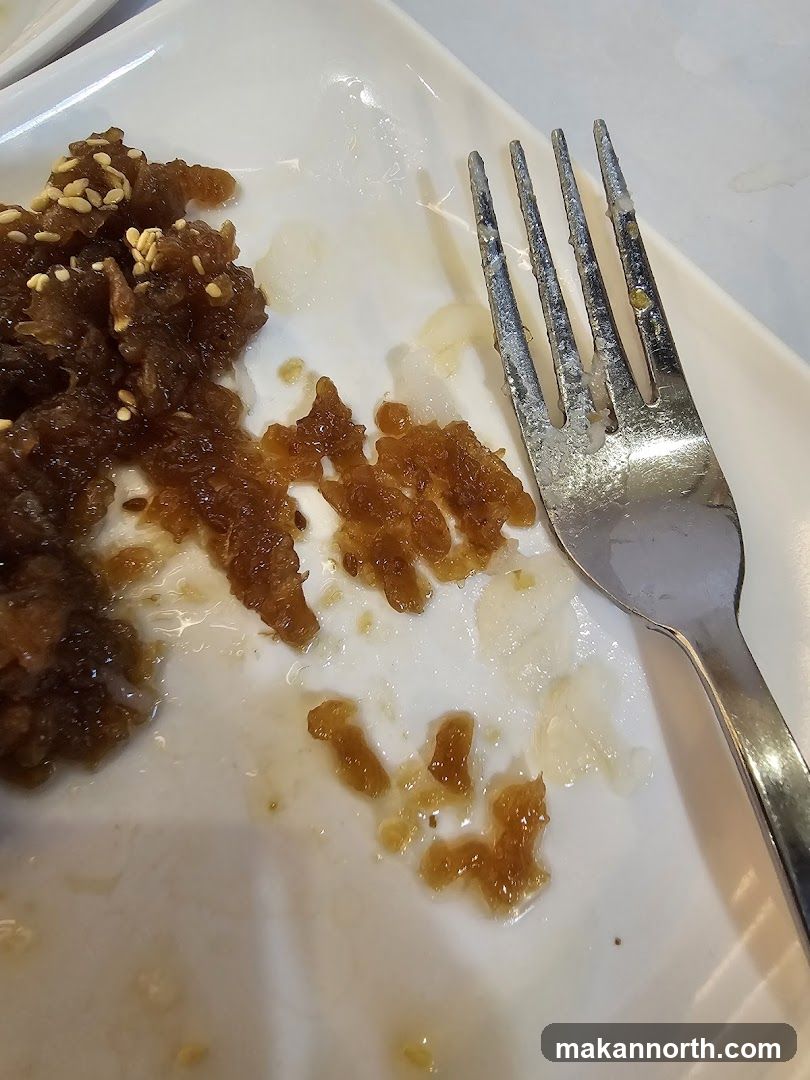 Dirty Plate with Food Remnants and Fork