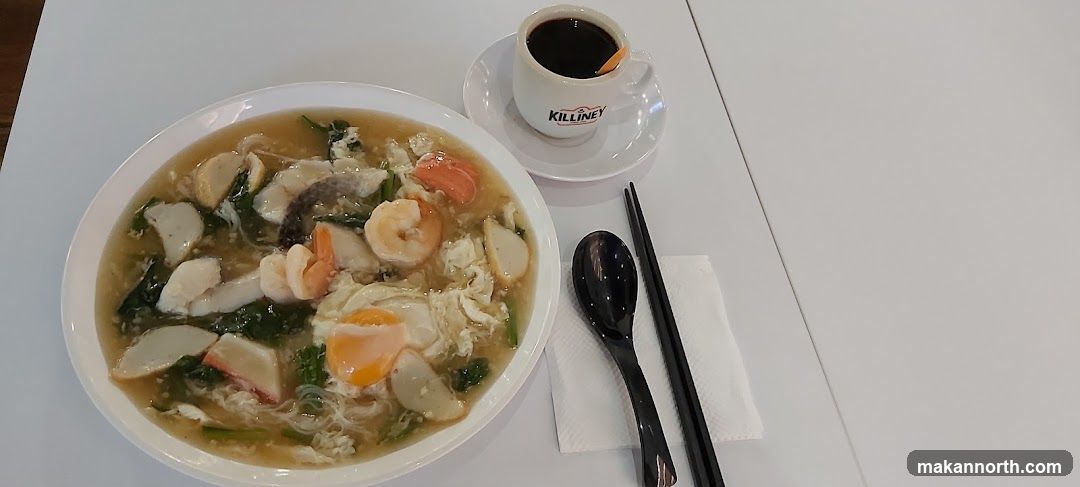 Seafood noodle soup with coffee