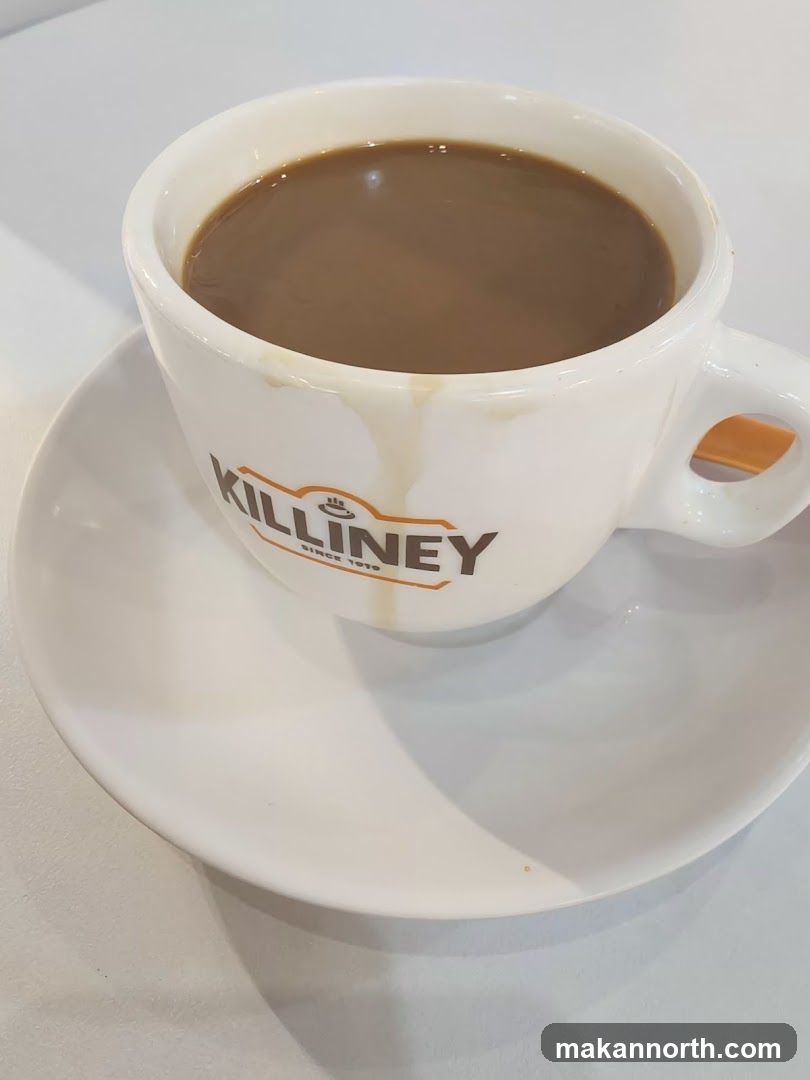 Coffee with milk in a branded cup