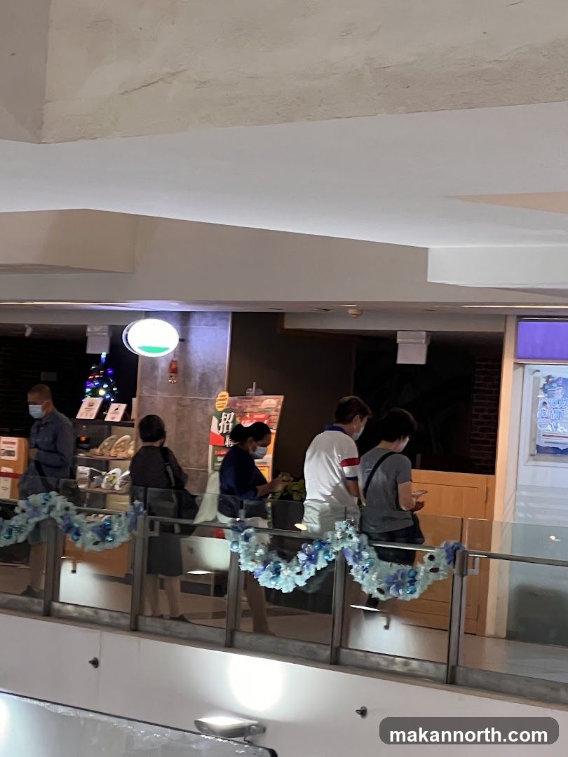 People queuing at a food stall