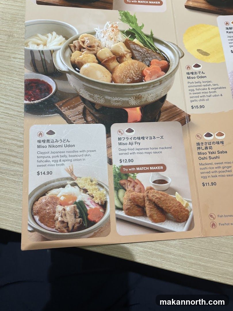 A menu featuring various Japanese dishes, including udon, fried fish, and sushi.