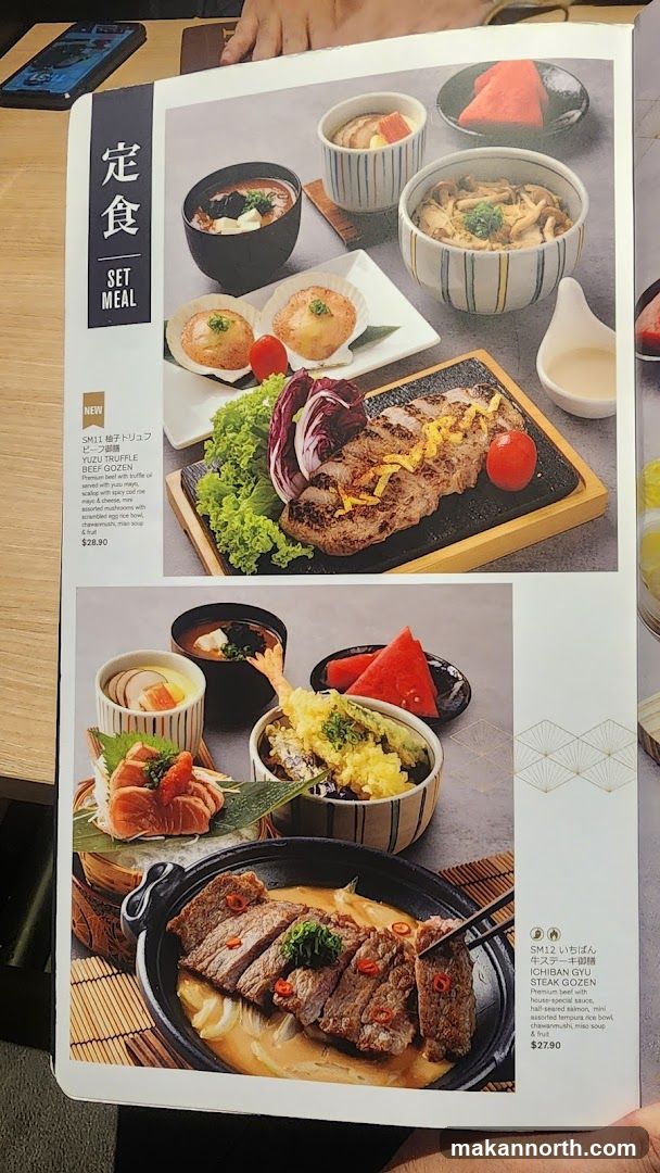 A menu page showcasing two set meals with accompanying dishes. The top set meal features beef with truffle and yuzu, served with soup, scallops, and other small dishes. The bottom set meal, labeled Ichiban Gyu Steak Gozen, includes premium beef steak, sashimi, tempura rice bowl, and soup.
